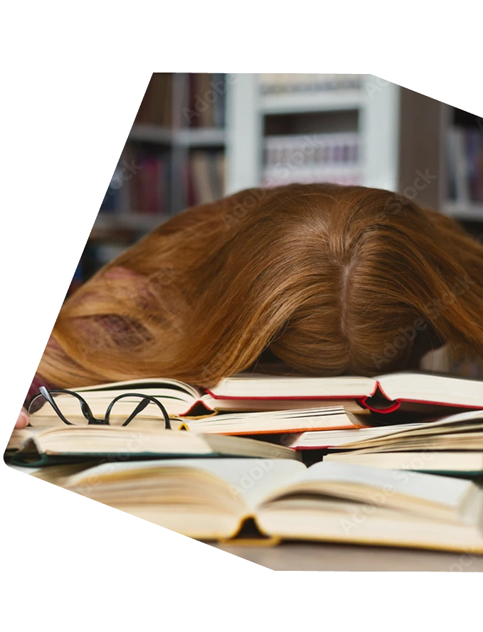 Stressed person over books in library